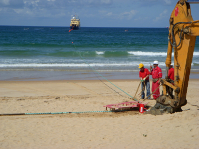  Excavator being used to “anchor” the quadrant on the beach
